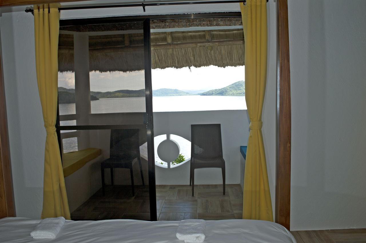 בוסואנגה Iris Island Eco Resort מראה חיצוני תמונה